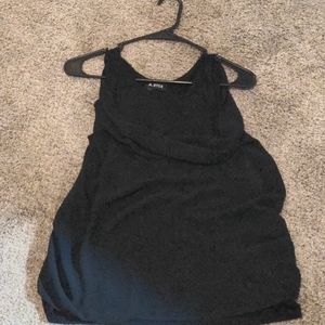 Black dressy tank with sheer scoop front piece.